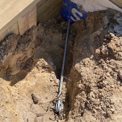 Retaining wall tieback for seawall