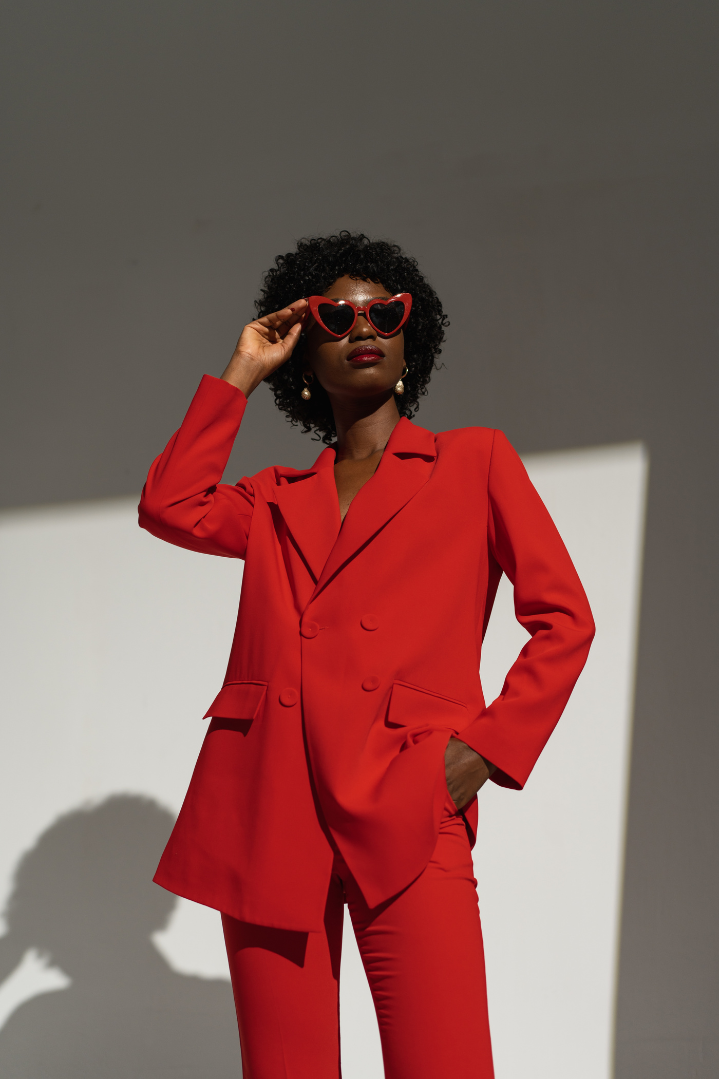 Black woman in red suit