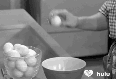 Person Cracking Eggs into Bowl Kitchen Black and White Hulu