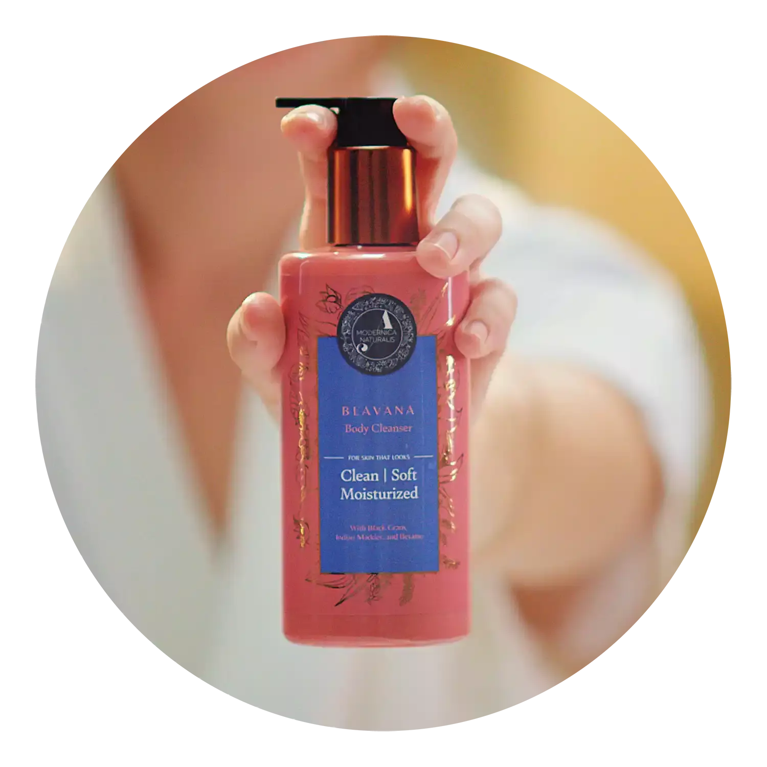 Woman's hand showing blavana cleanser bottle