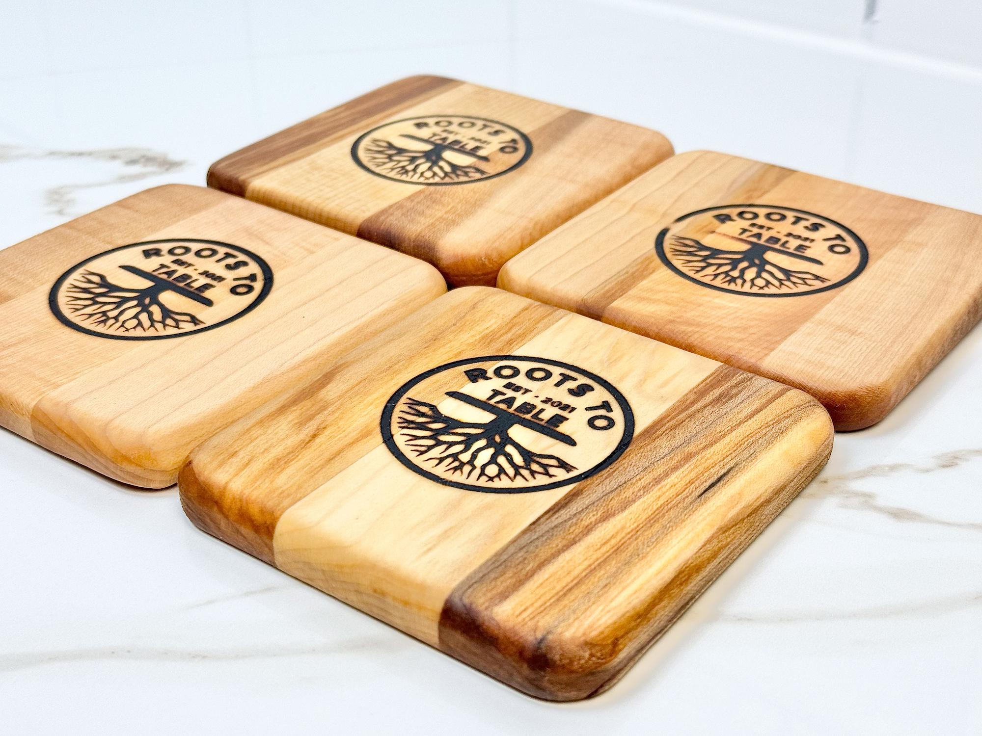 A set of 4 square maple wood drink coasters