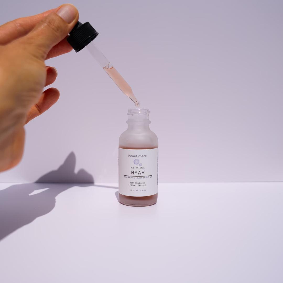 hand using a dropper from hyah serum