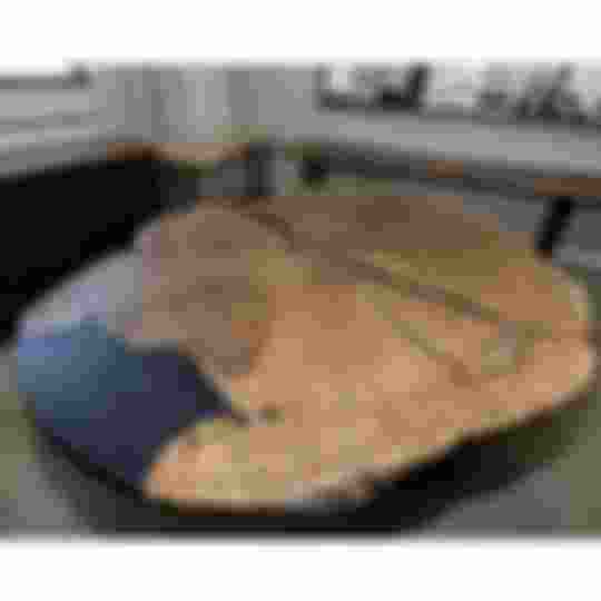 round live edge oak epoxy dining table with black epoxy