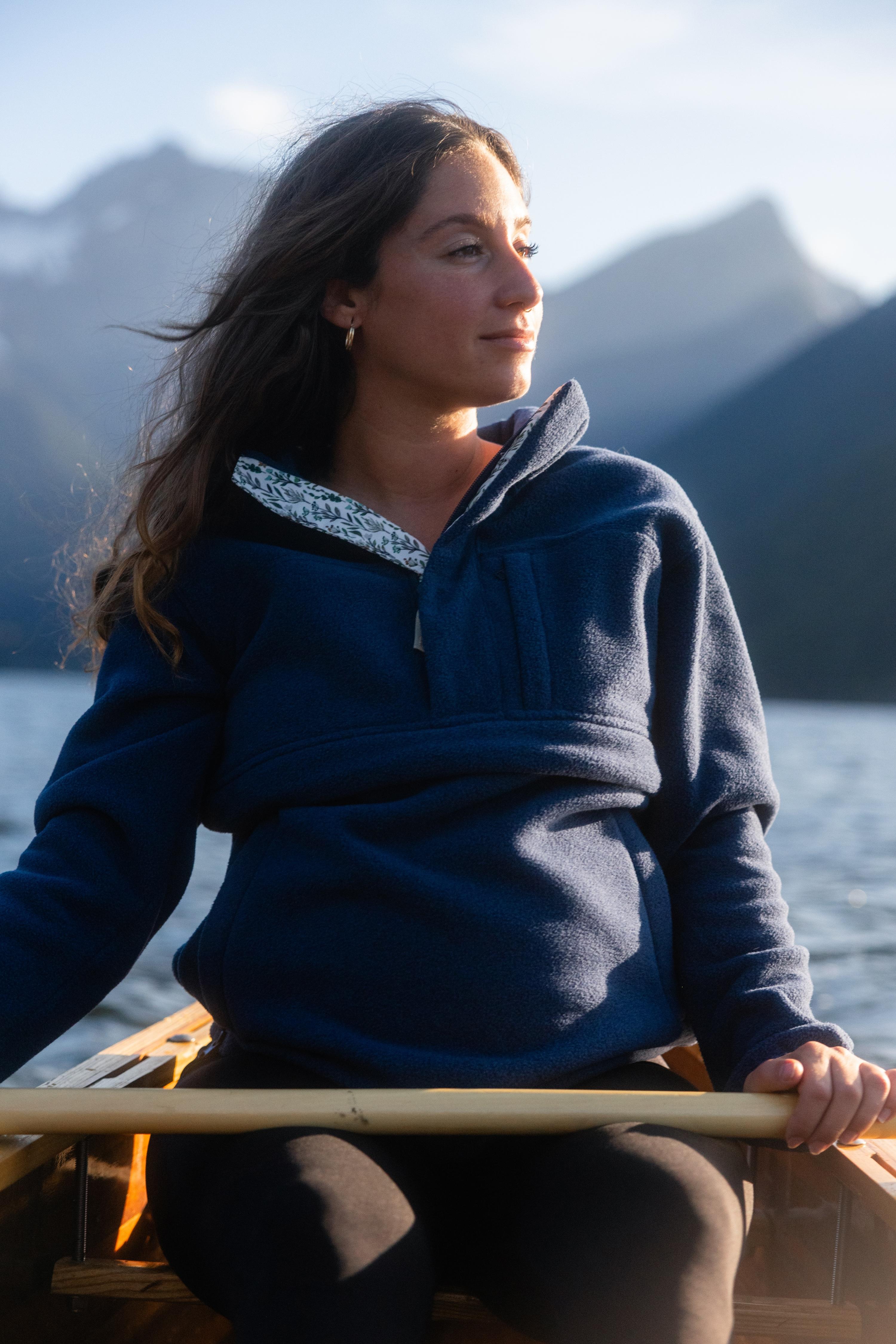 Pregnant mom in canoe surrounded by mountains in All Phases Fleece