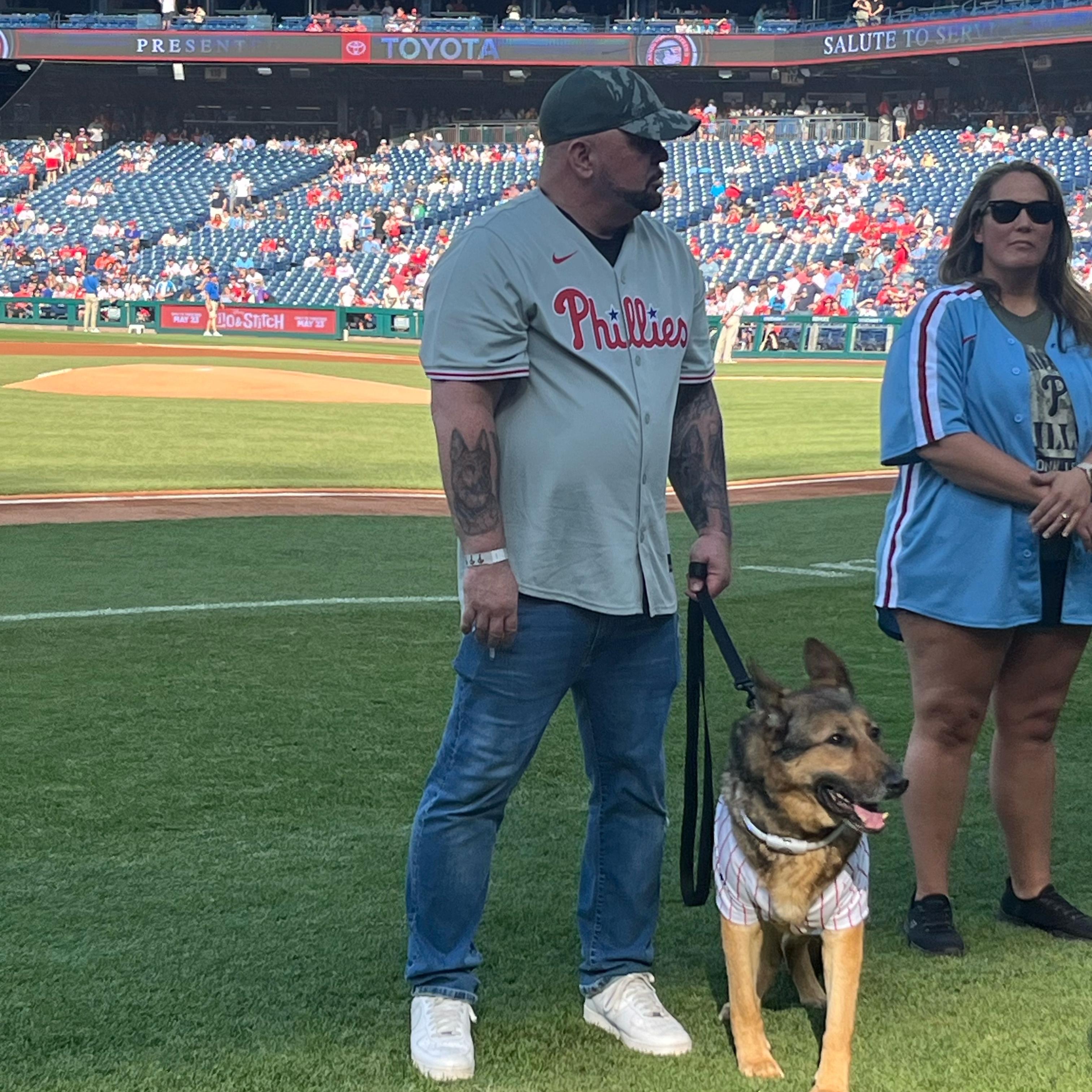 tambo on the field with his handler