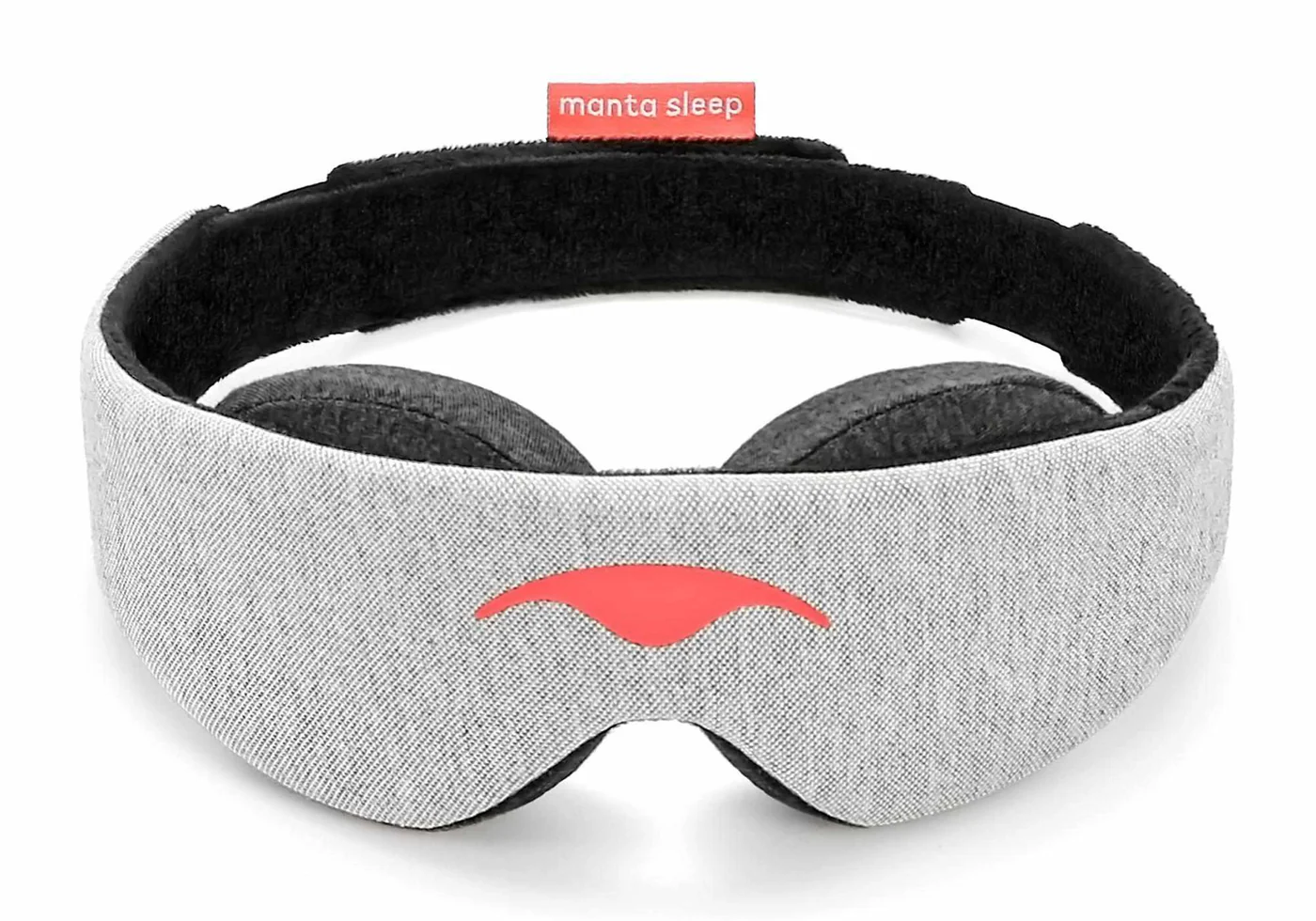 A gray sleep mask with eye cups for sleeping in a hotel room.