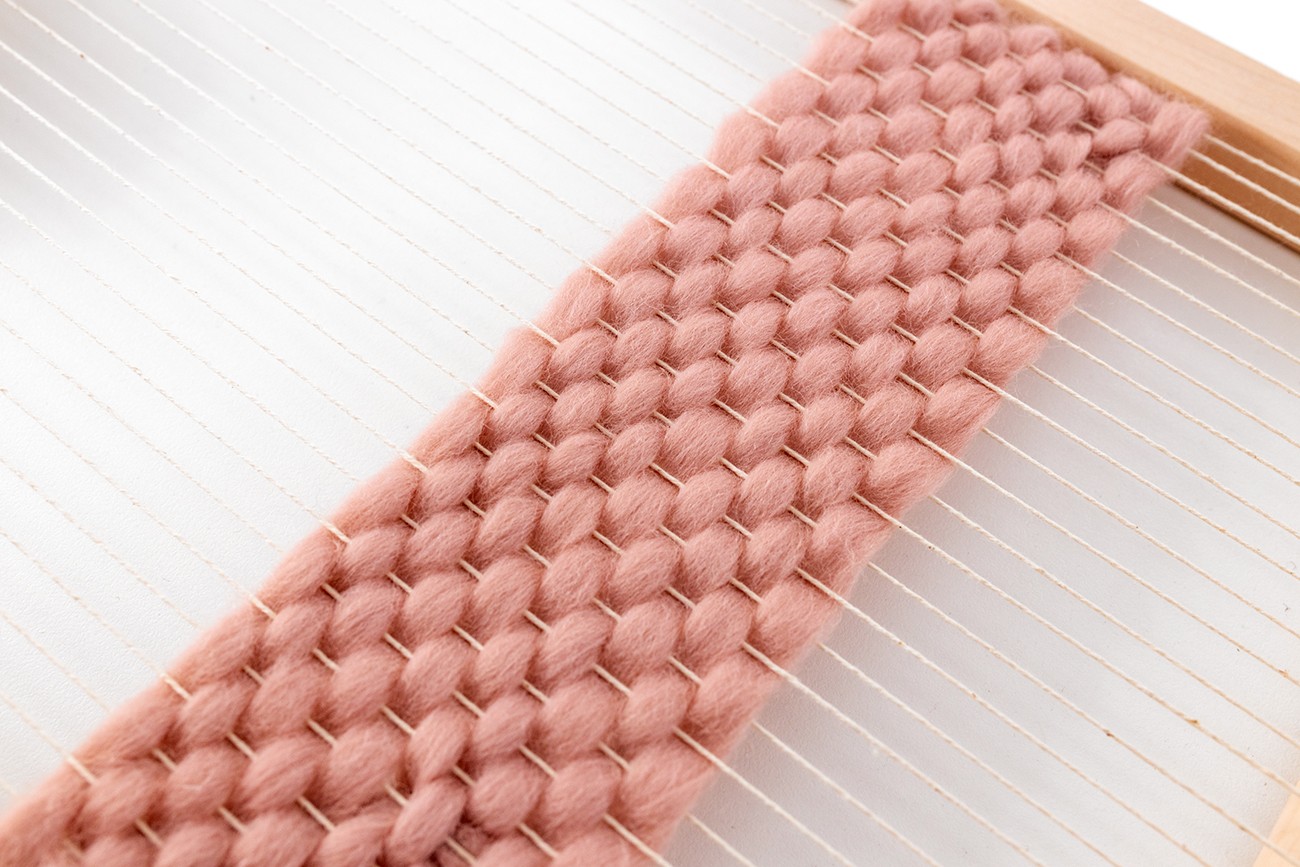 This is a close-up image of tabby weave on a loom.