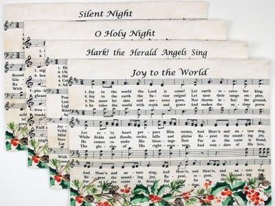 four placemats with sheet music for common Christmas carols
