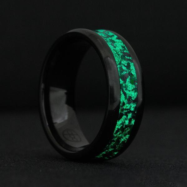 The Kaiju Black Ceramic Ring is a handcrafted black ring and features a unique glow and opal inlay