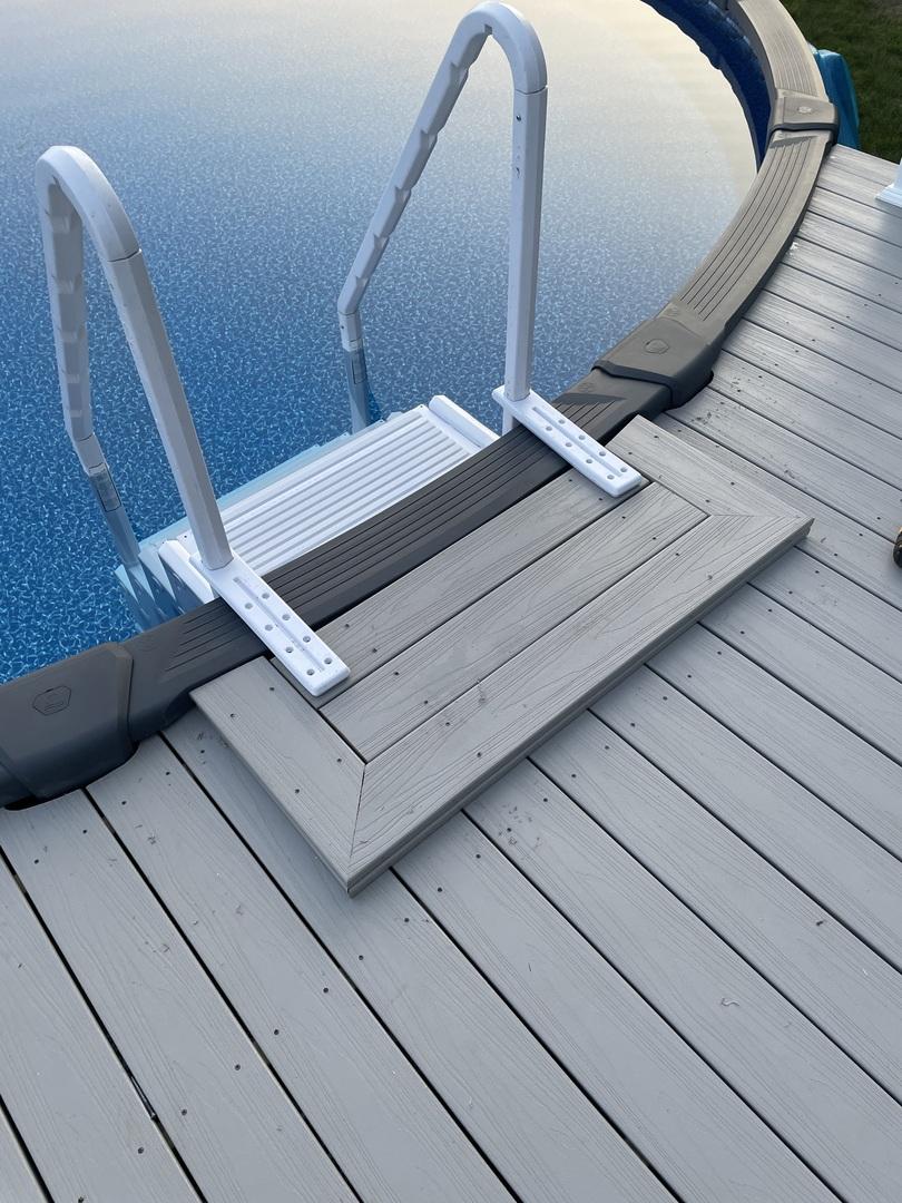 ladder descending from the deck into the pool