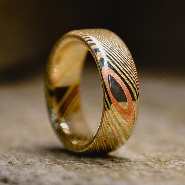 Mokume gane made from copper turned into a mens wedding ring.