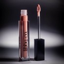 Plumping Lip Gloss - Nude Pout vial standing next to applicator with shadows in background