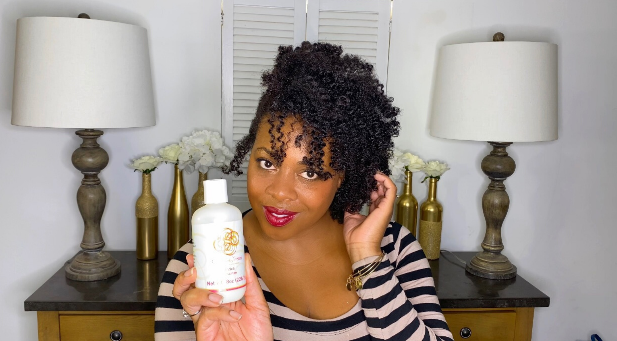 Midlife Black woman with natural curls smiling confidently