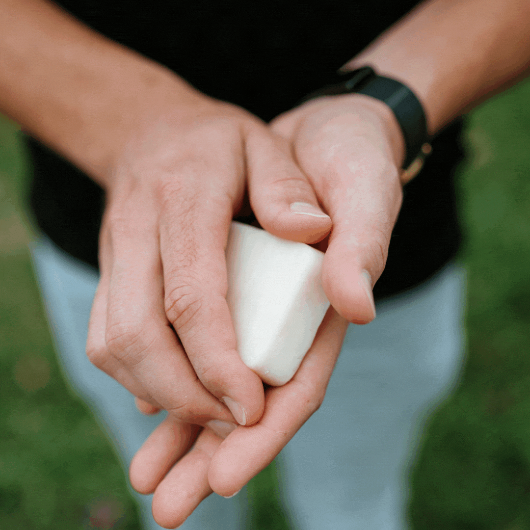 gif of man holding lotion bar with text overlay of a beesilk review