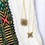 Yenaé Lalibela and Axum Crosses Antique 14K Gold Plated Necklace On a Fabric