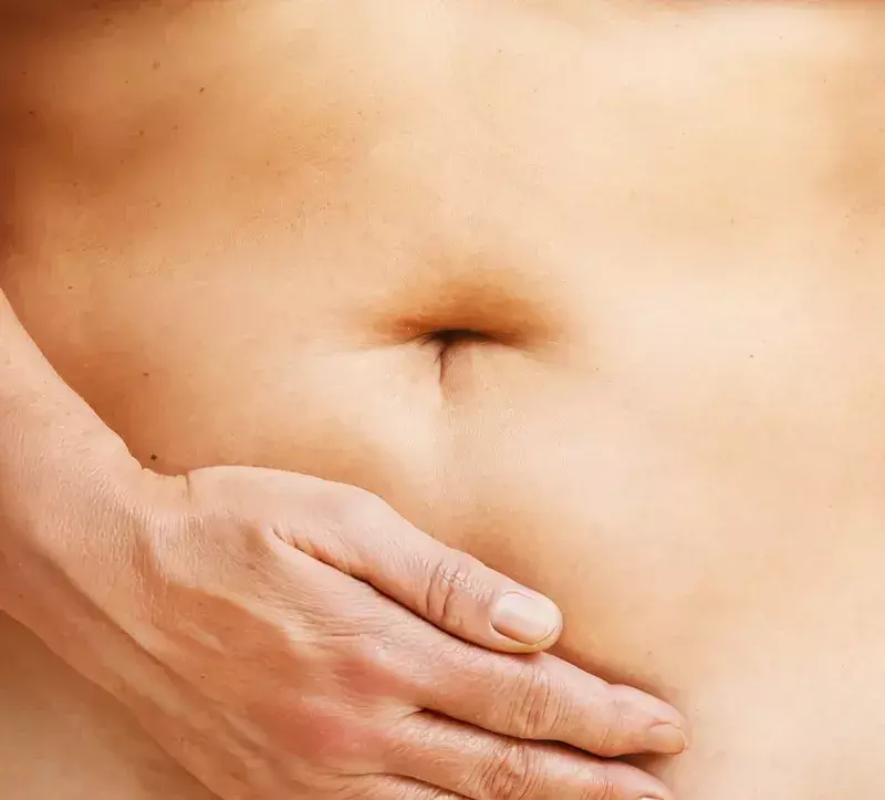 woman massaging belly with Balaayah