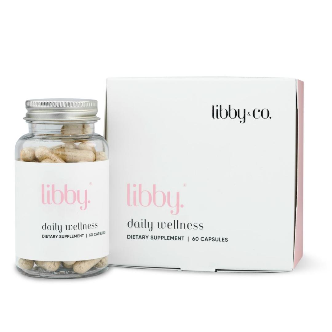 Bottle of Libby capsules next to its packaging on a white background.