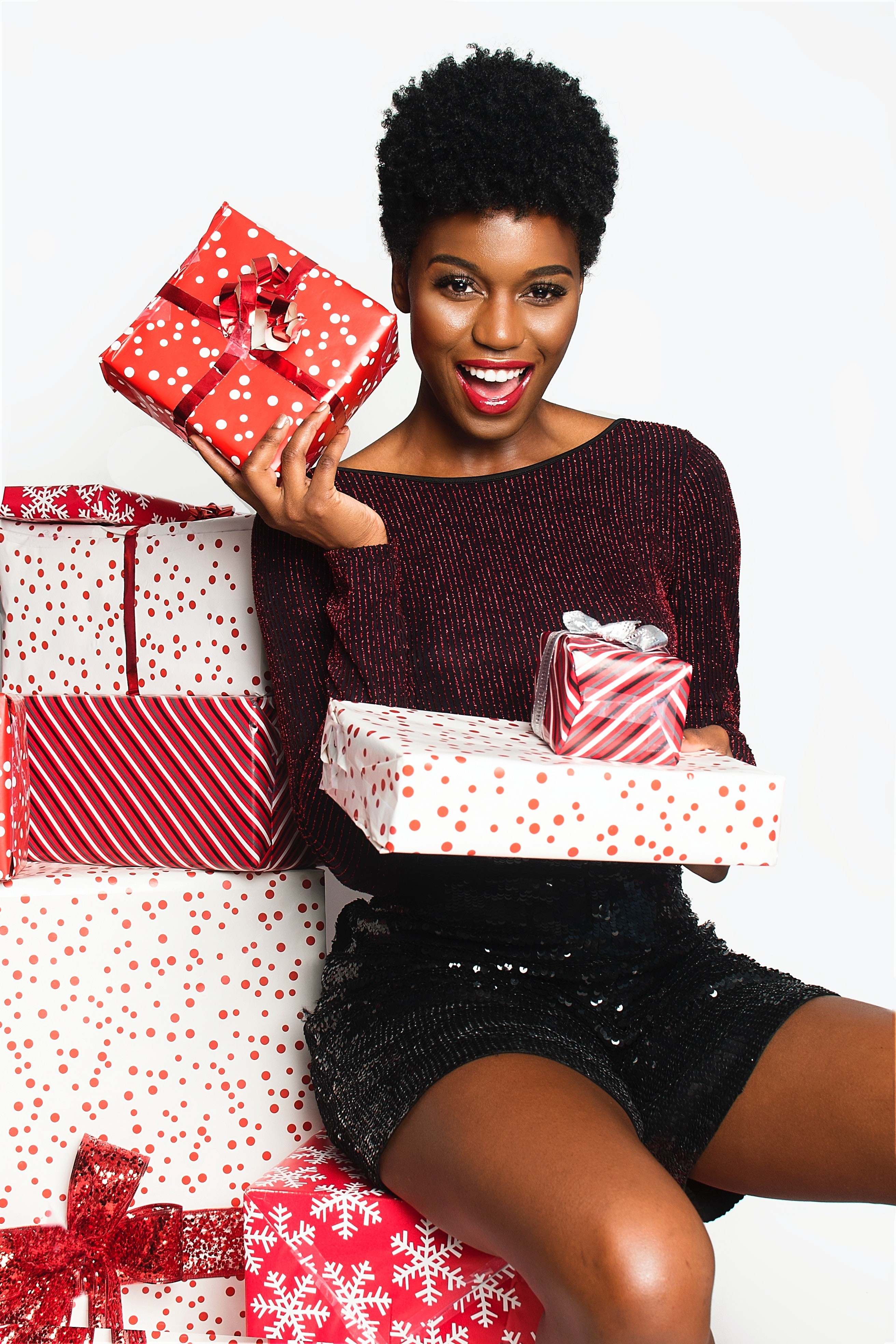 Black woman with Christmas gifts