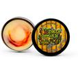 An open tin of dirty dangles tiki deke limited edition tropical stick wax on a white background