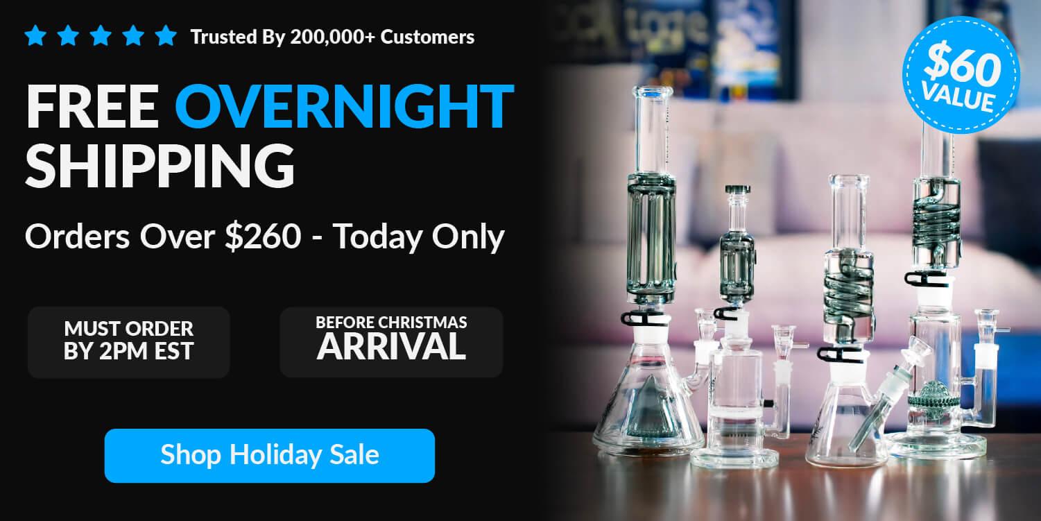 glass bongs on table in front of couch