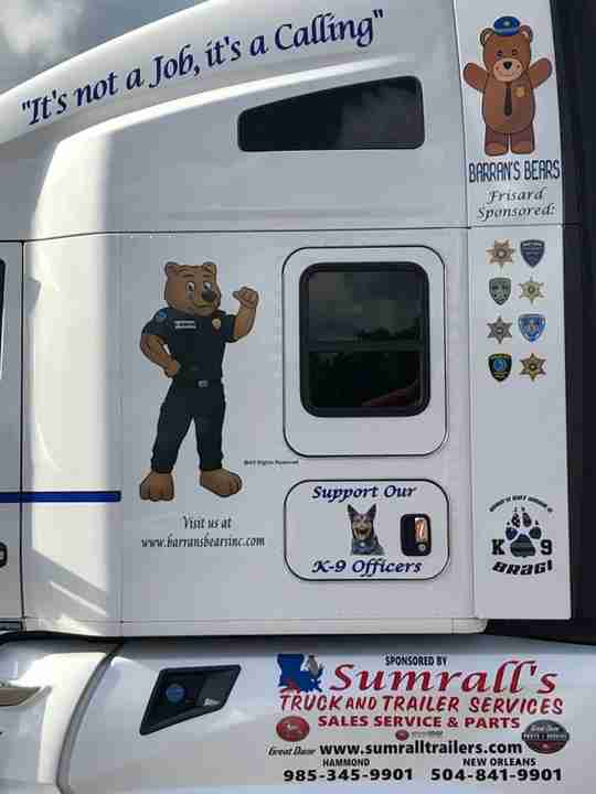 A truck outfitted with Barran's Bear logo.