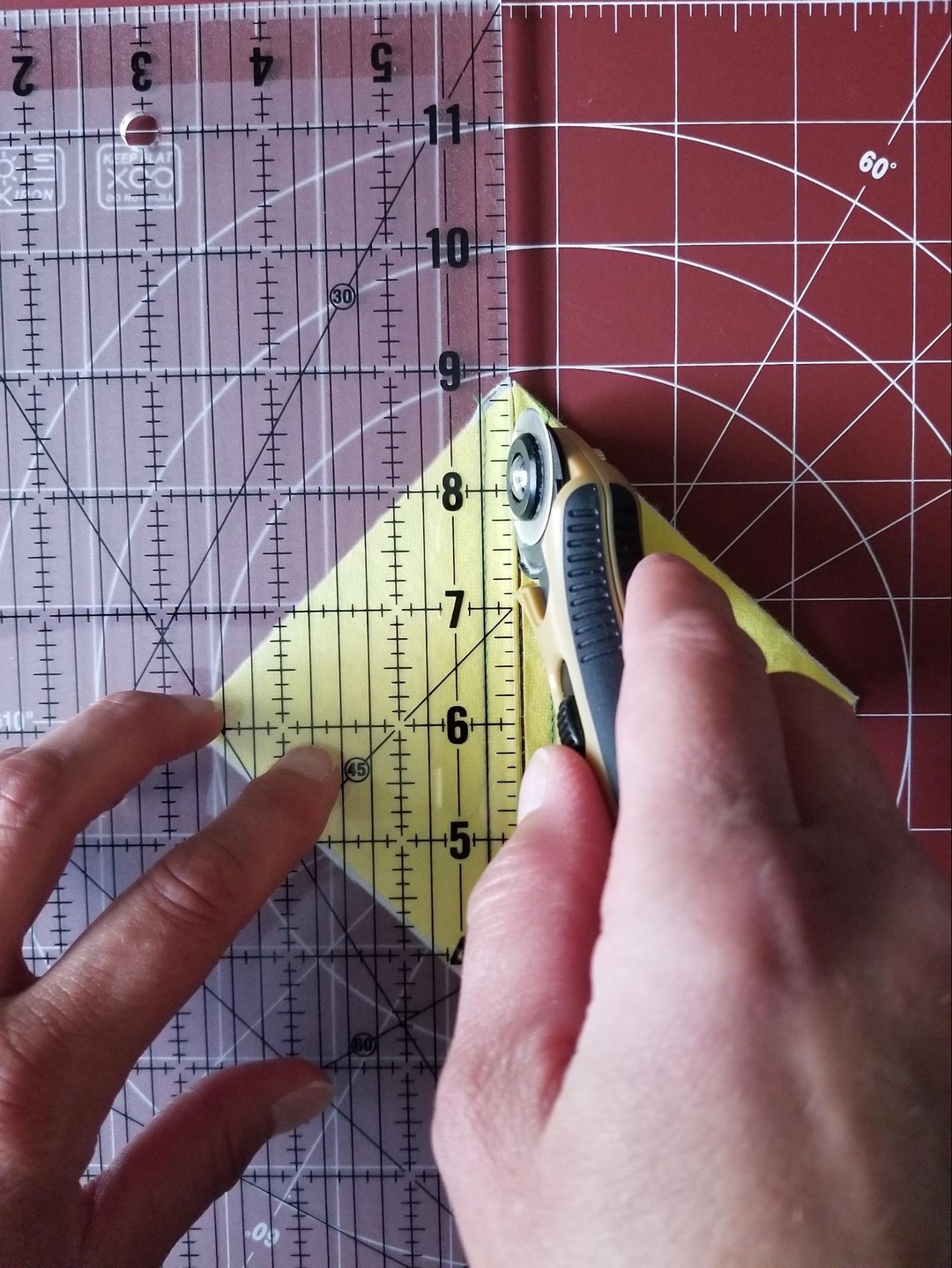 Cutting using unit to make half-square triangle pieces - using cutting ruler, mat and rotary cutter