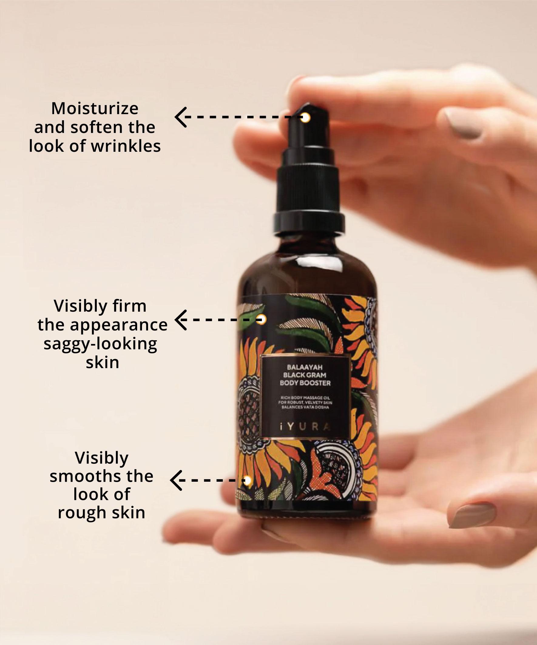 hand holding balaayah bottle showing various benefits