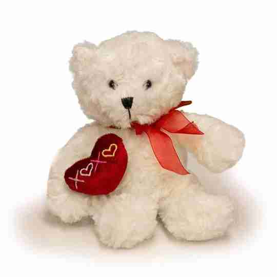 A white bear with red bow tie and red heart that has XOXO embroidered on it.