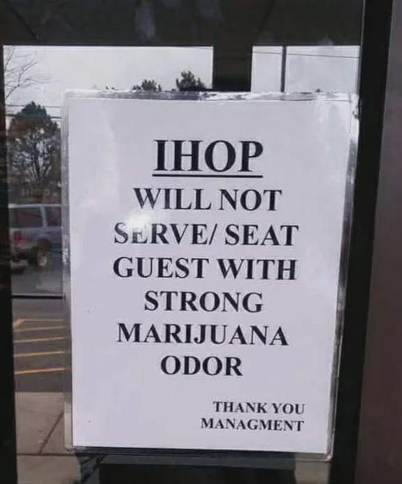 Photo of an IHOP restaurant sign prohibiting service to customers with a cannabis aroma, illustrating the outdated stigma that functional glass smokeware and the cannabis community have defied, demanding mainstream respect.