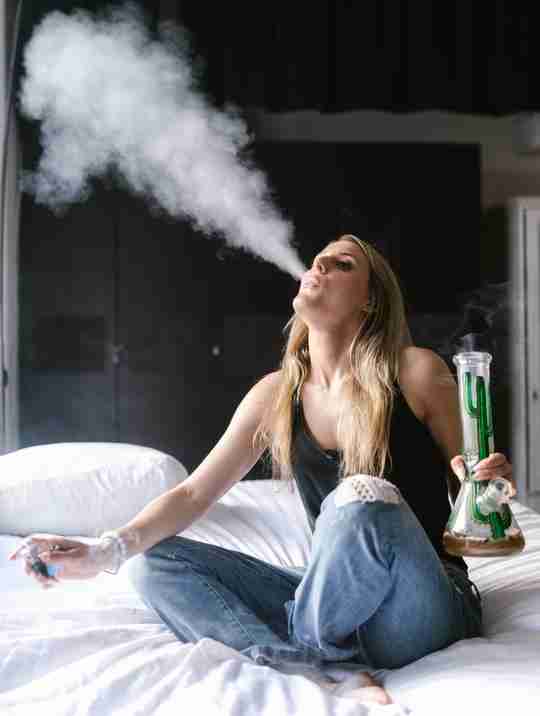 woman smoking a bong