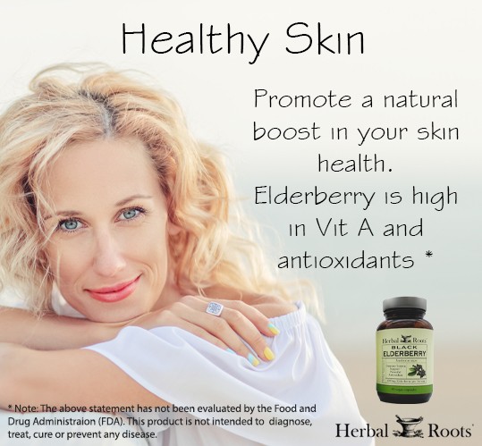 Middle aged blond women looking at camera with chin resting on folded arms. Arm resting on table. Text on image says healthy skin. Promote a natural boost in your skin health. Elderberry is high in vit A and antioxidants.