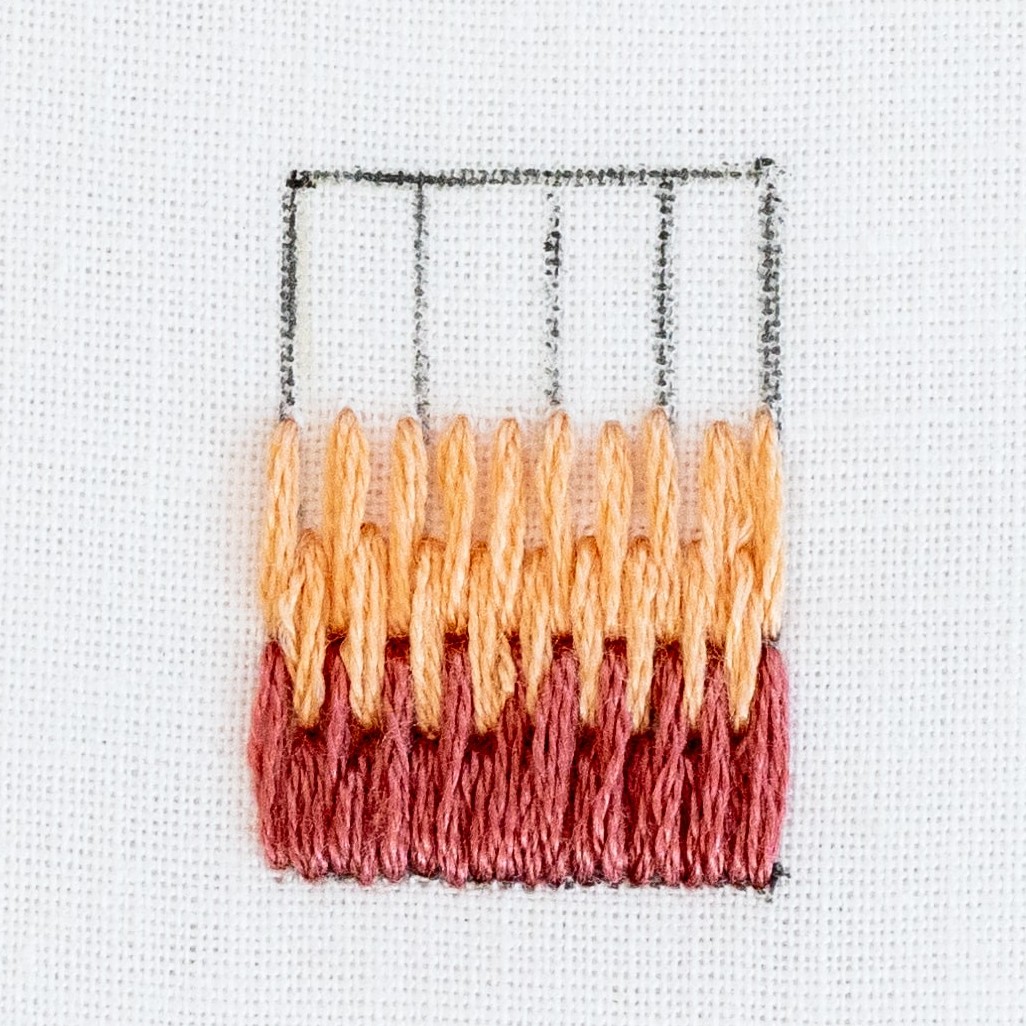 This is an image of step 2 of long and short stitch.