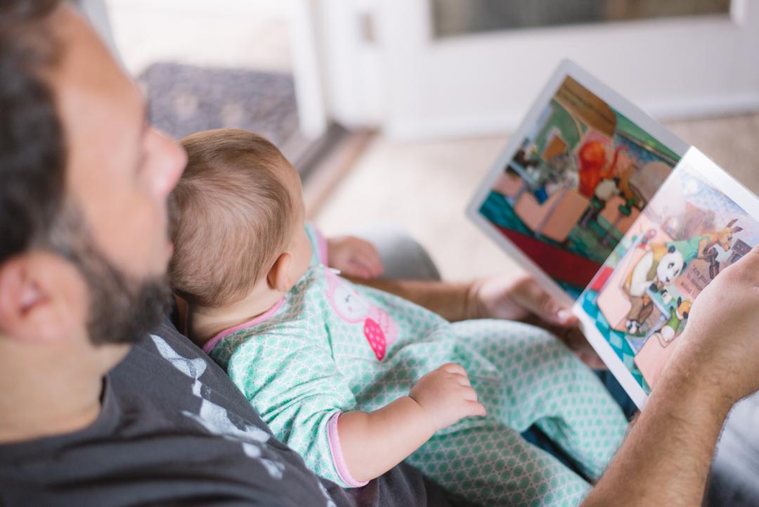 Dad reading to kid