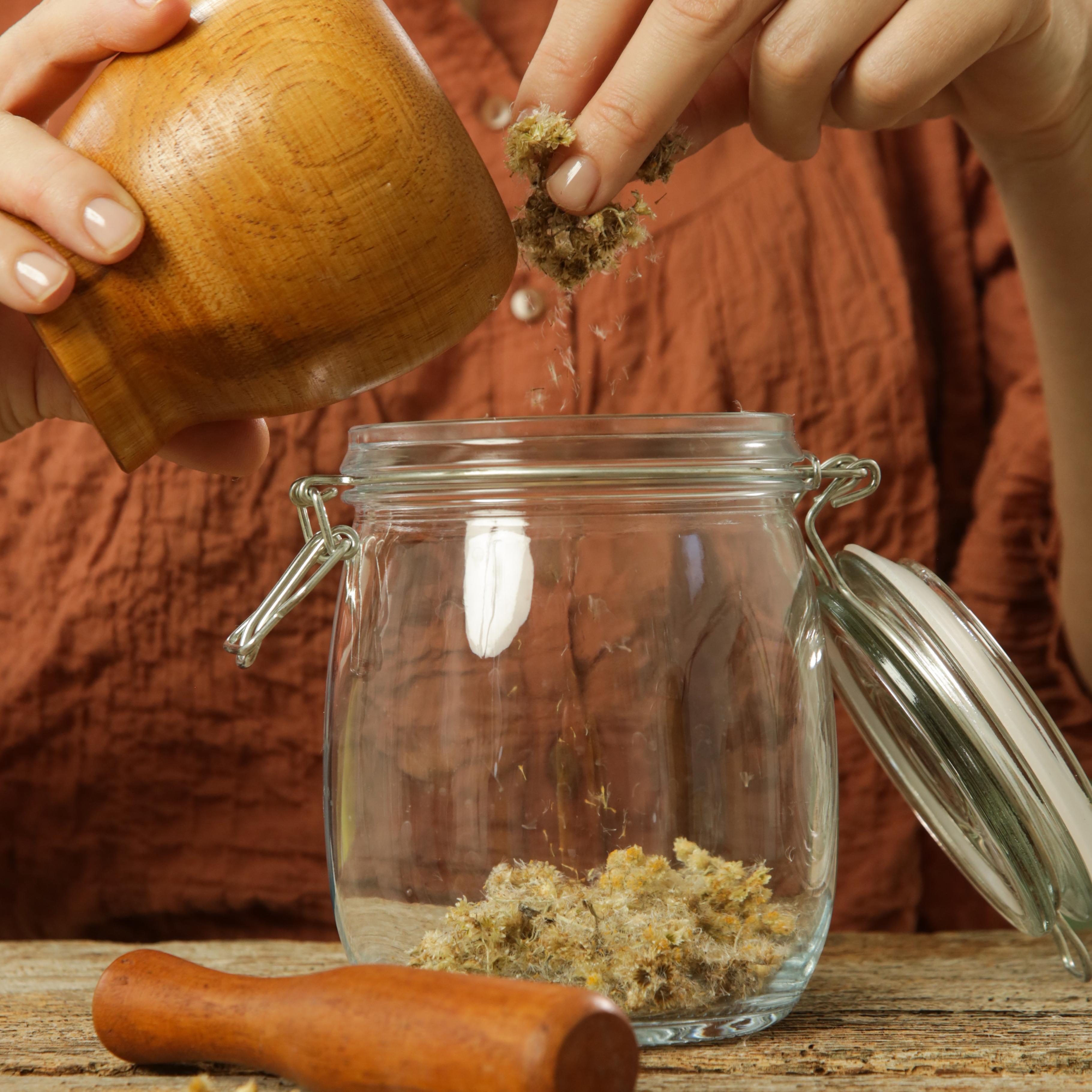 Placing the flowers in the jar