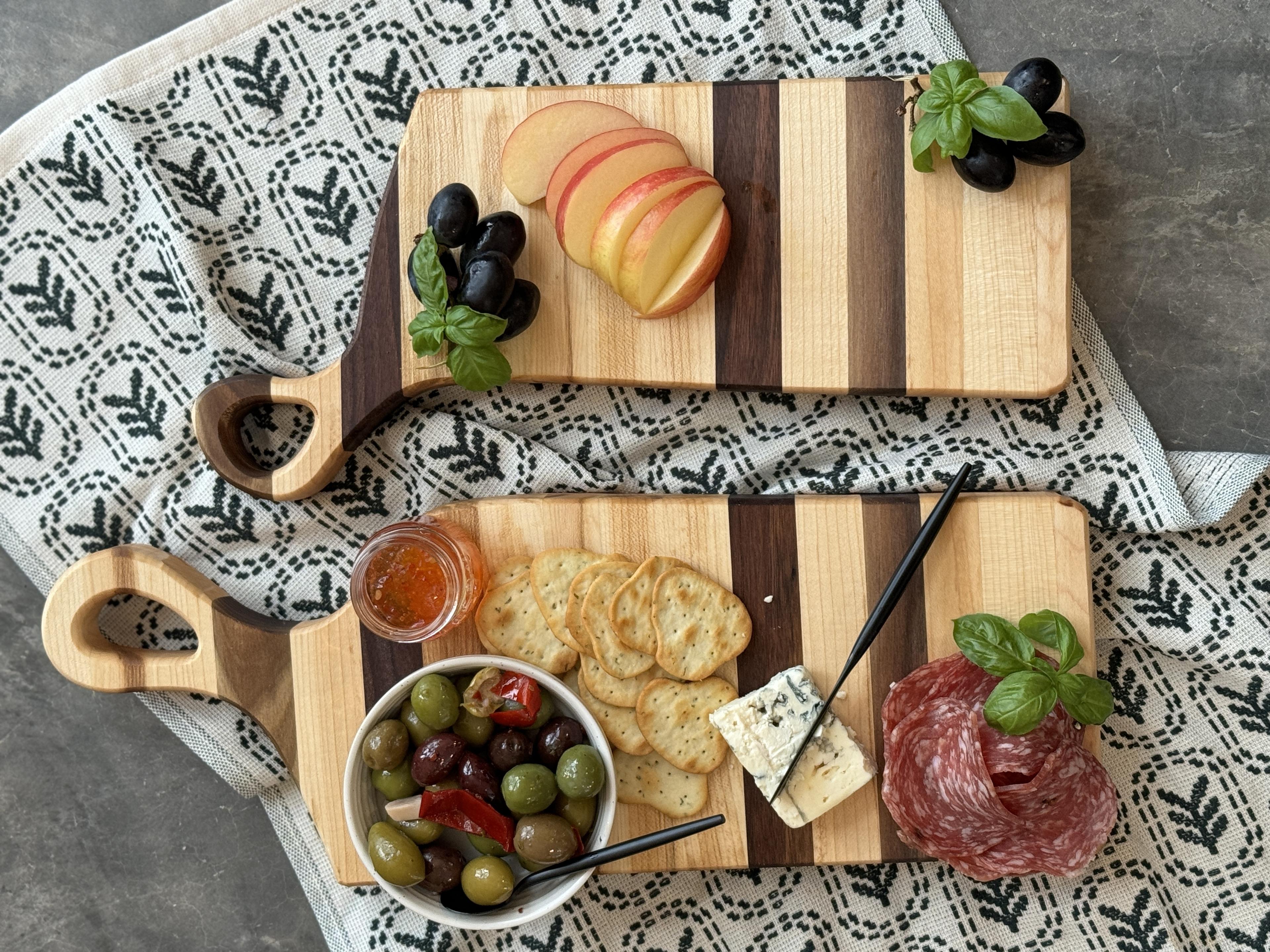 The nestling timbers charcuterie board with an assortment of foods on it