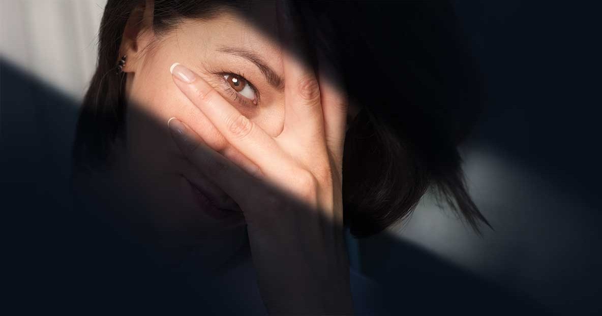 Woman's eyes highlighted by a streak of light