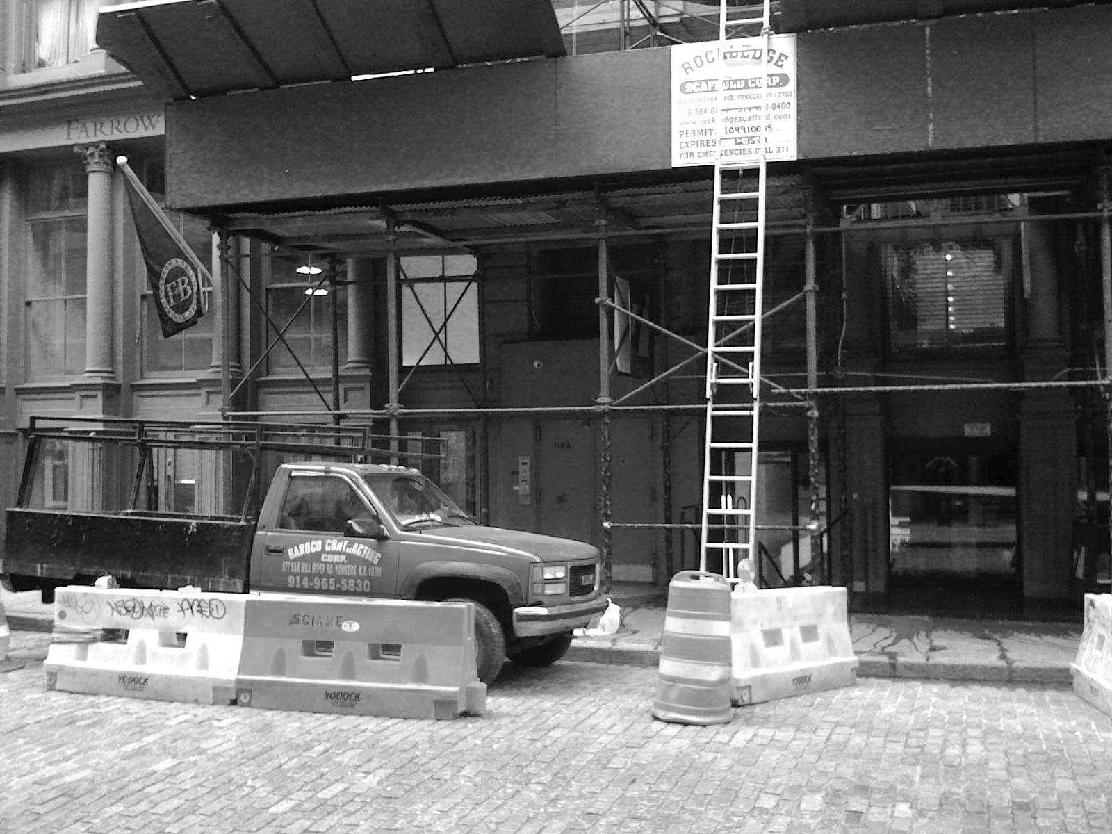 Seven New York hidden behind scaffolding, 2011.