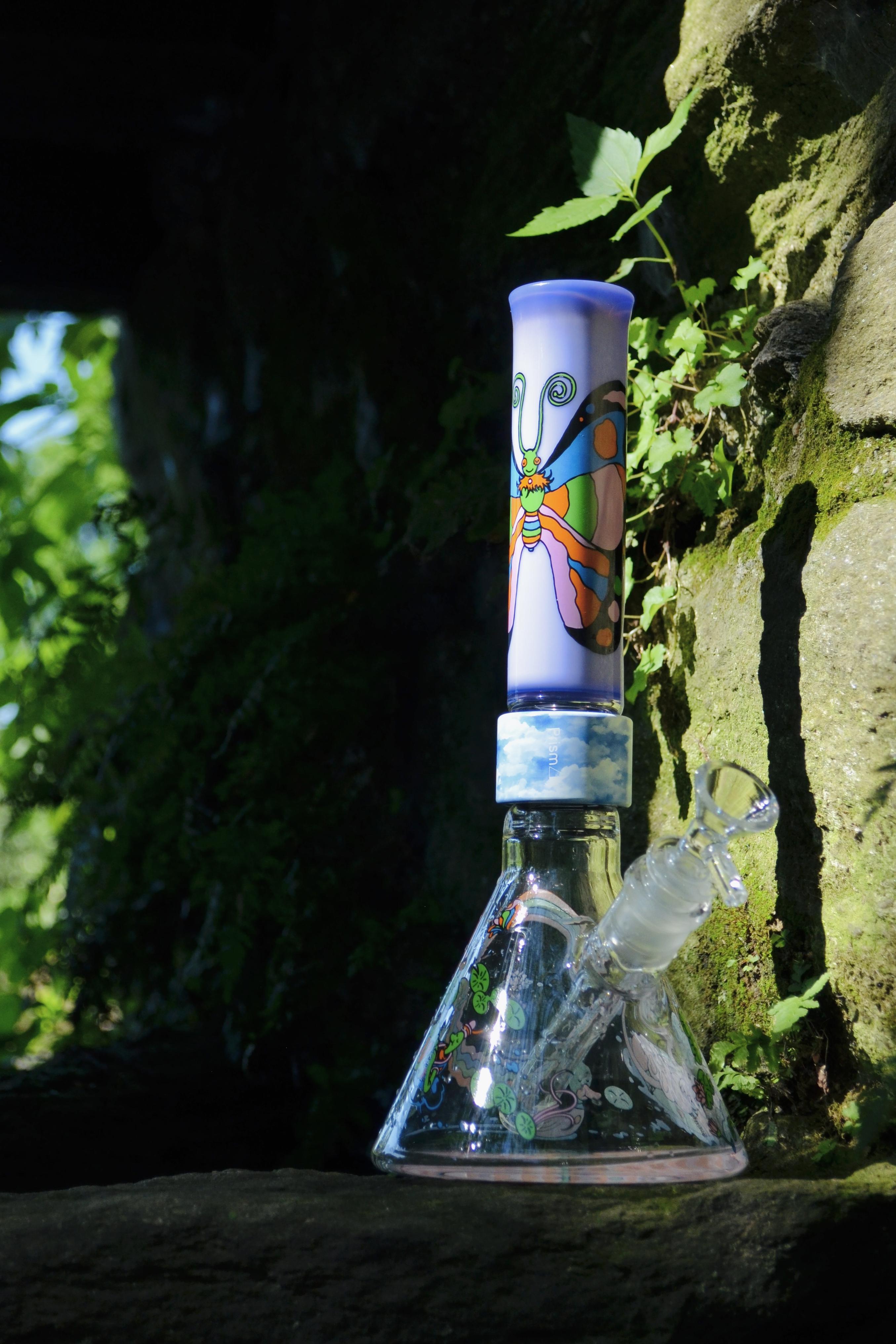 An image of a prism MINI bong with Pond Life decals on a Grape Taffy MINI standard mouthpiece and with a clear bowl