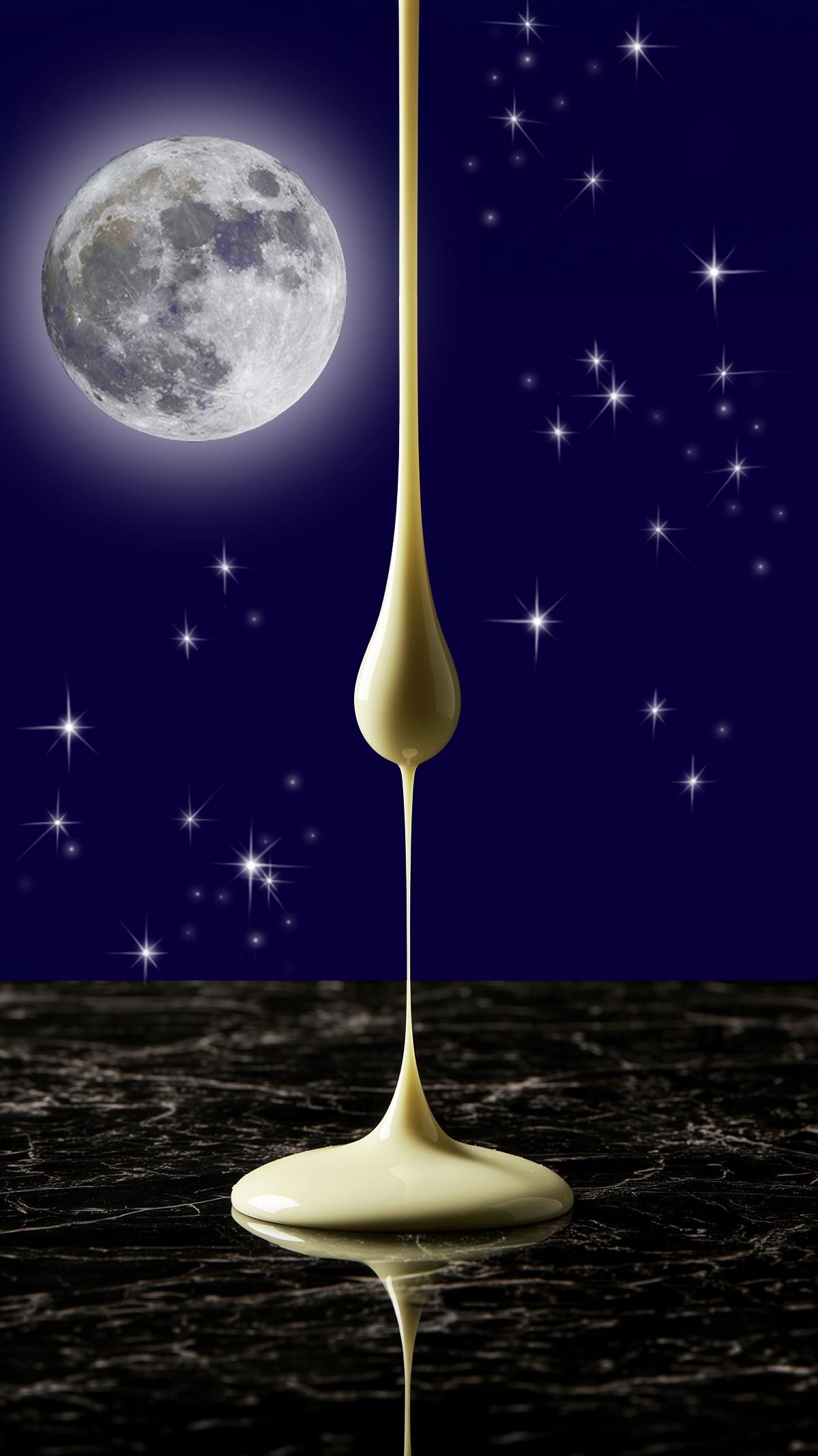 Bleeding Heart white chocolate in front of full moon