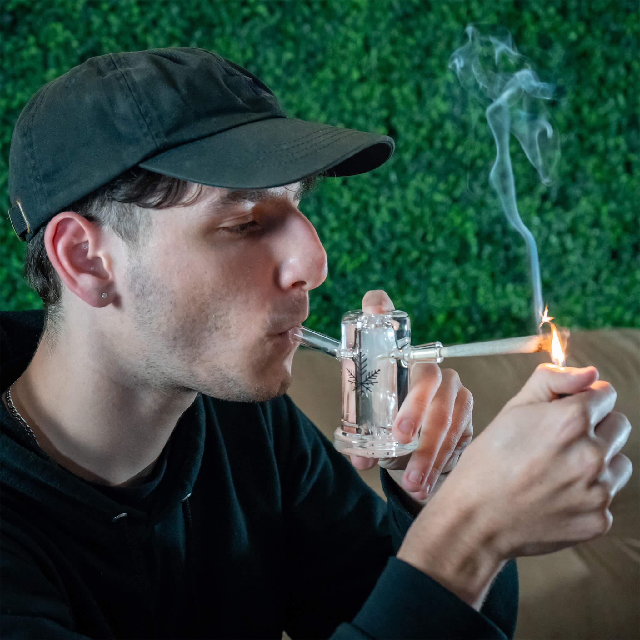 person smoking with joint bubbler