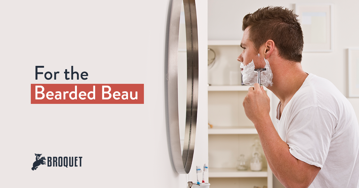 man shaving in front of bathroom mirror, broquet logo, text reads: For the Bearded Beau