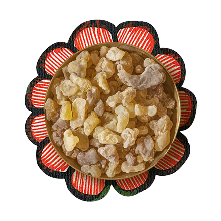 A bunch of brown colored frankincense kept over a white color background