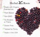 many Elderberries shaped into a heart. Text on image says Herbal Roots made with organic elderberries, plant based, non-GMO, no binders or fillers, gluten free, tested for purity, made in the usa.