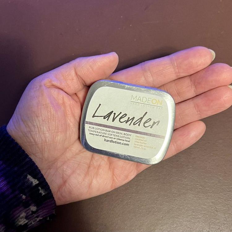 customer holding lavender lotion bar