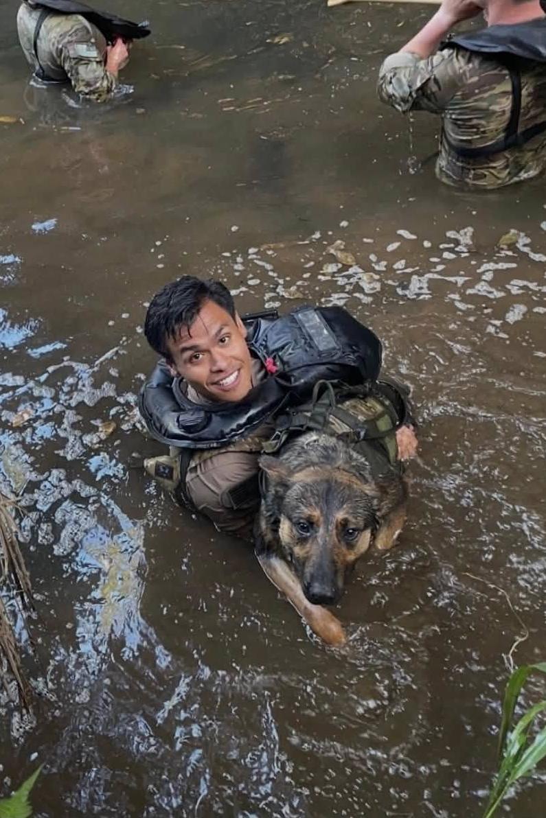 mpc jack and his handler swimming