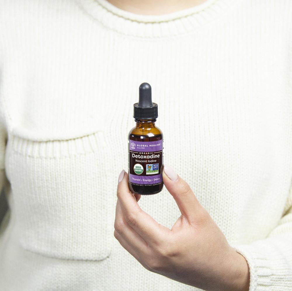 Global Healing Organic Detoxadine Nascent Iodine 1fl oz Bottle in hand