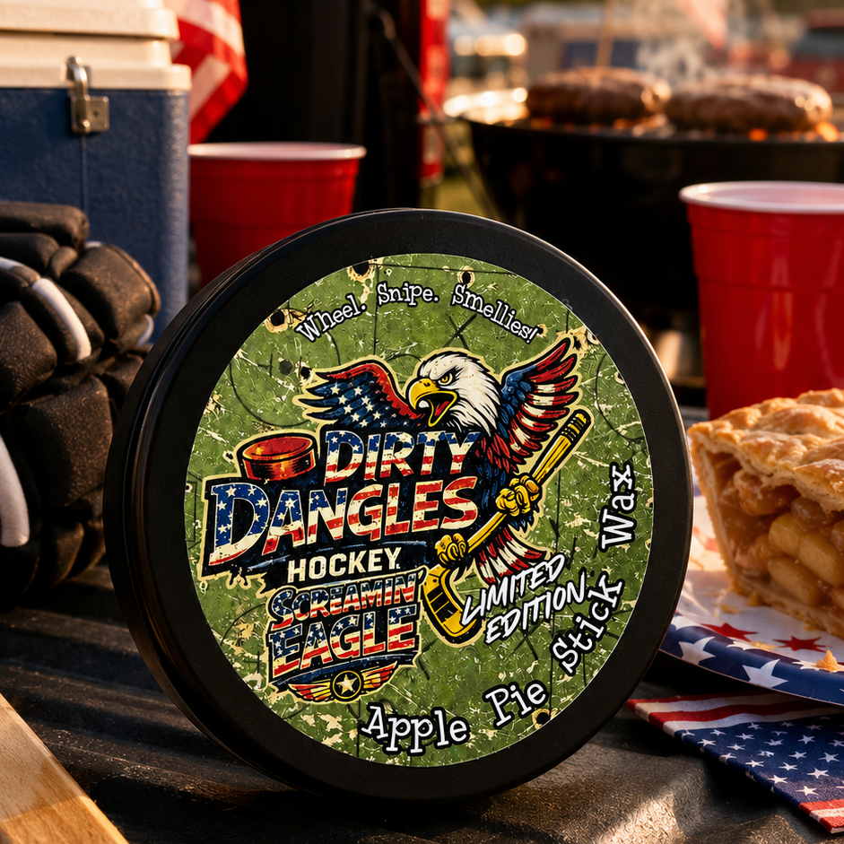 A tin of dirty dangles screamin eagle 4th of july stick wax on a truck tailgate with apple pie and american flags