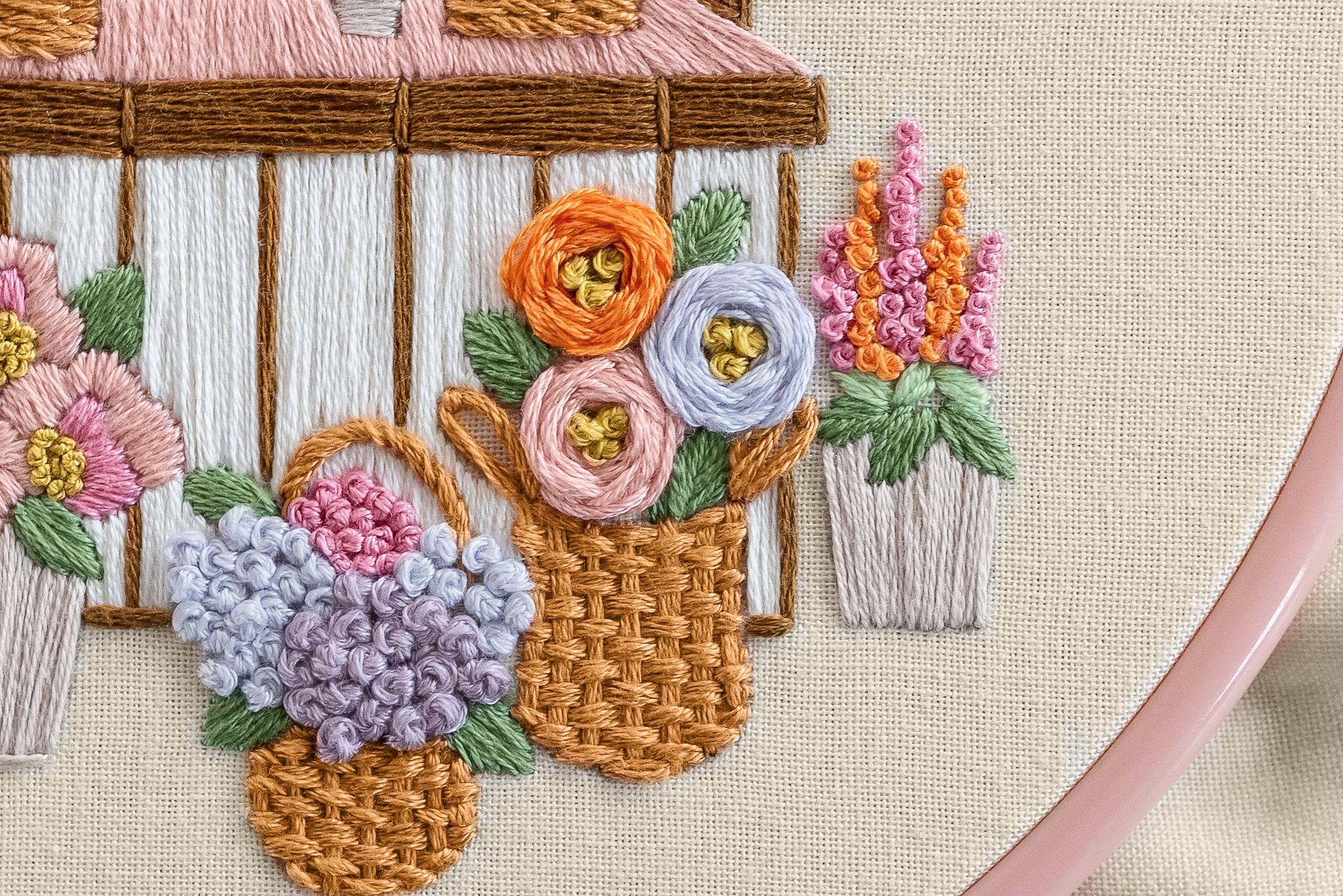 The Flower Stall embroidery pattern, with weave stitch adding texture among the florals.