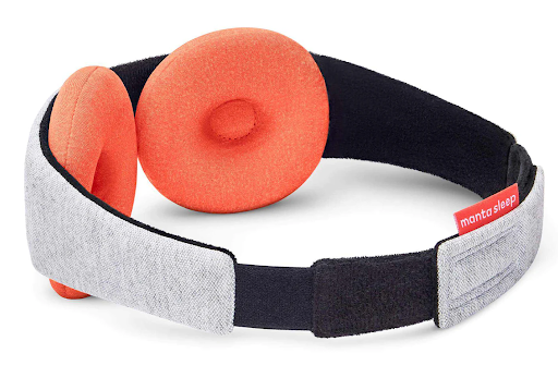 The interior of a therapy sleep mask with orange warming eye cups.