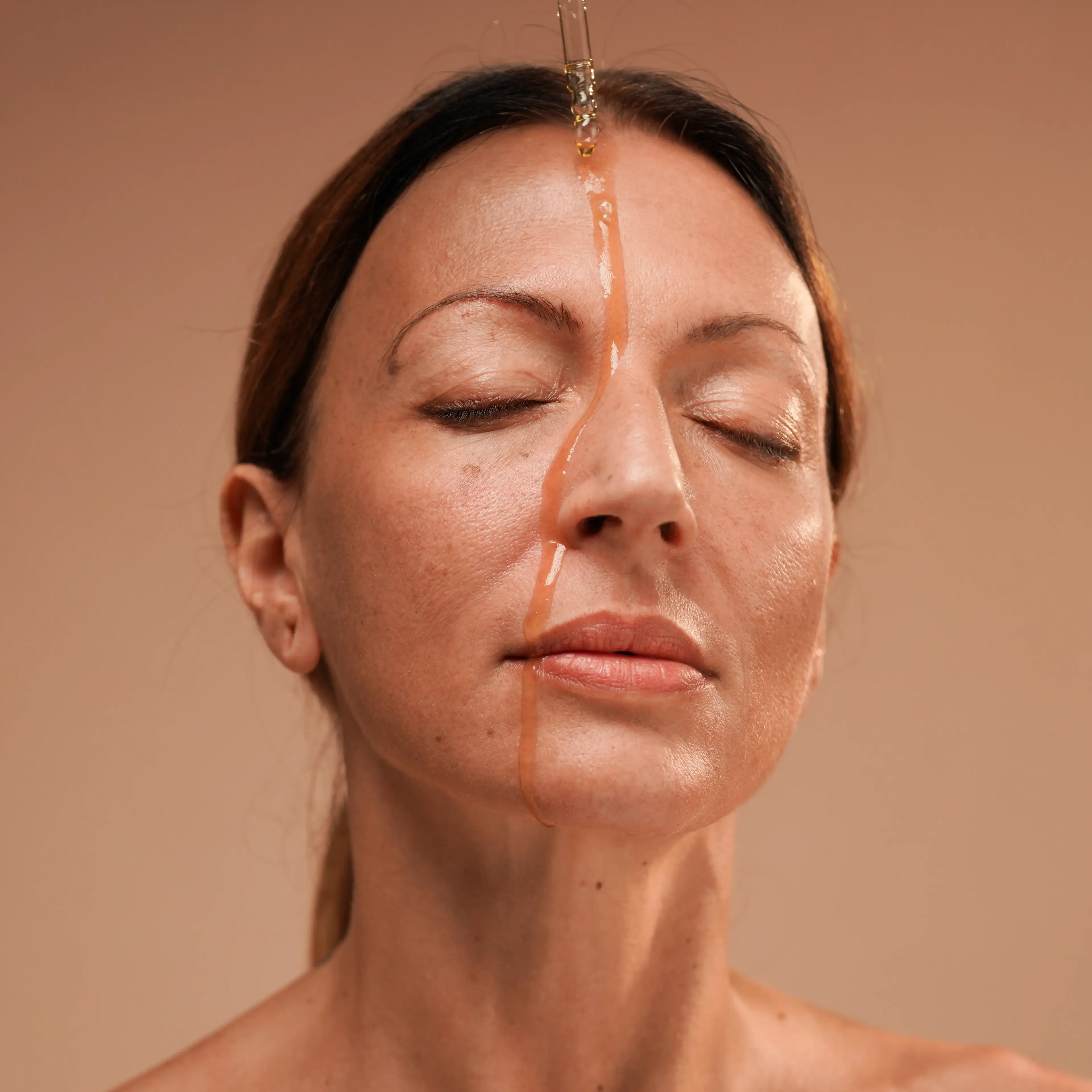 oil dripping down woman's face